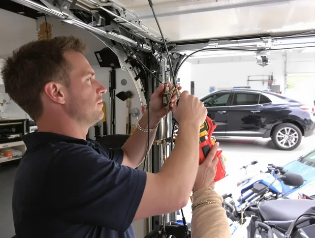 Lynnfield Garage Door Repair safety certified technician performing cable replacement in Lynnfield
