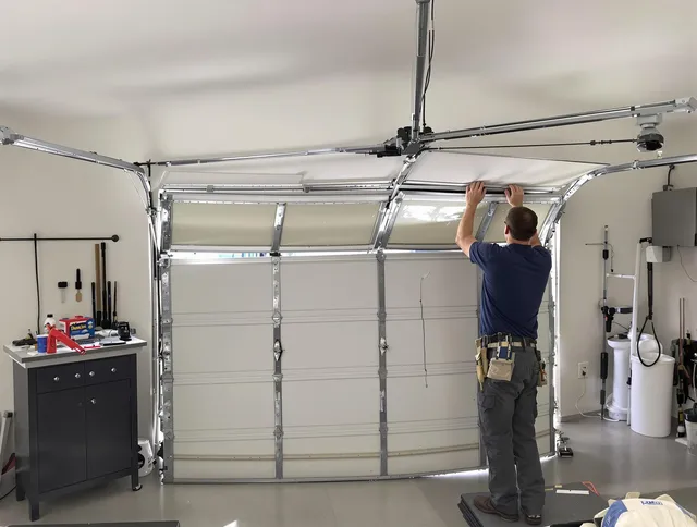 Lynnfield Garage Door Repair specialist performing precise section replacement on Lynnfield garage door